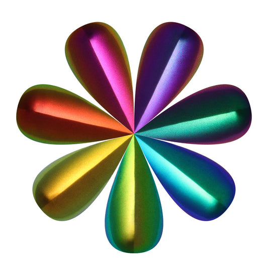 Multicolored metallic NAILSPIRACY signature flower-shaped object on a white background