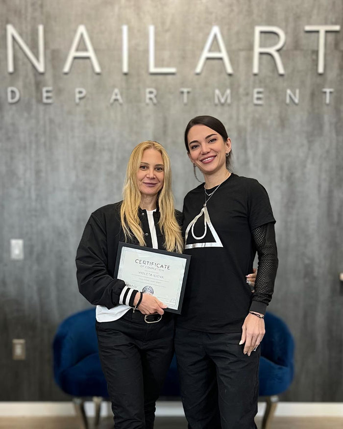 Nailspiracy Academy student with certificate