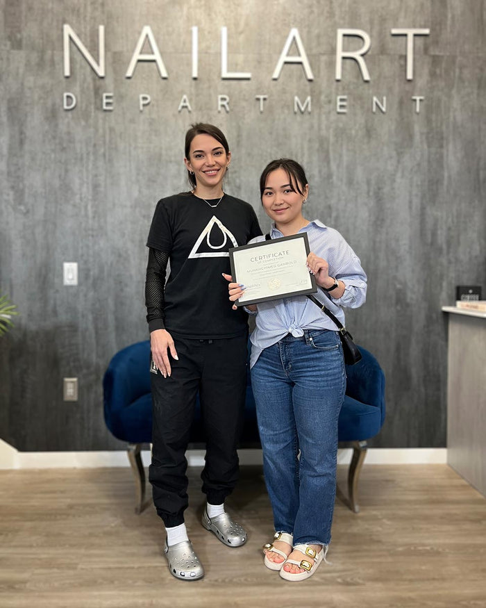 Nailspiracy Academy student with certificate
