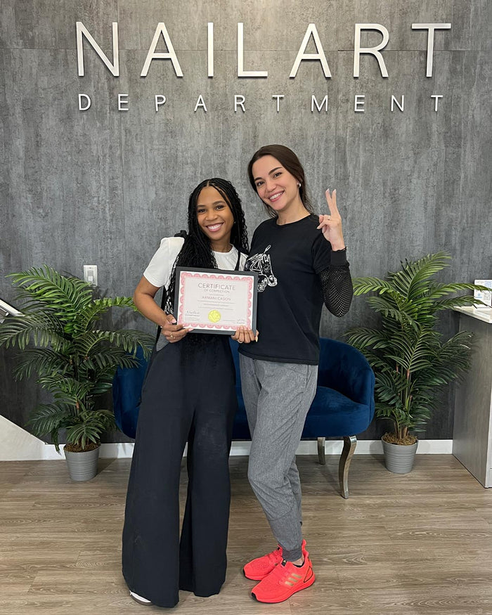 Nailspiracy Academy student with certificate