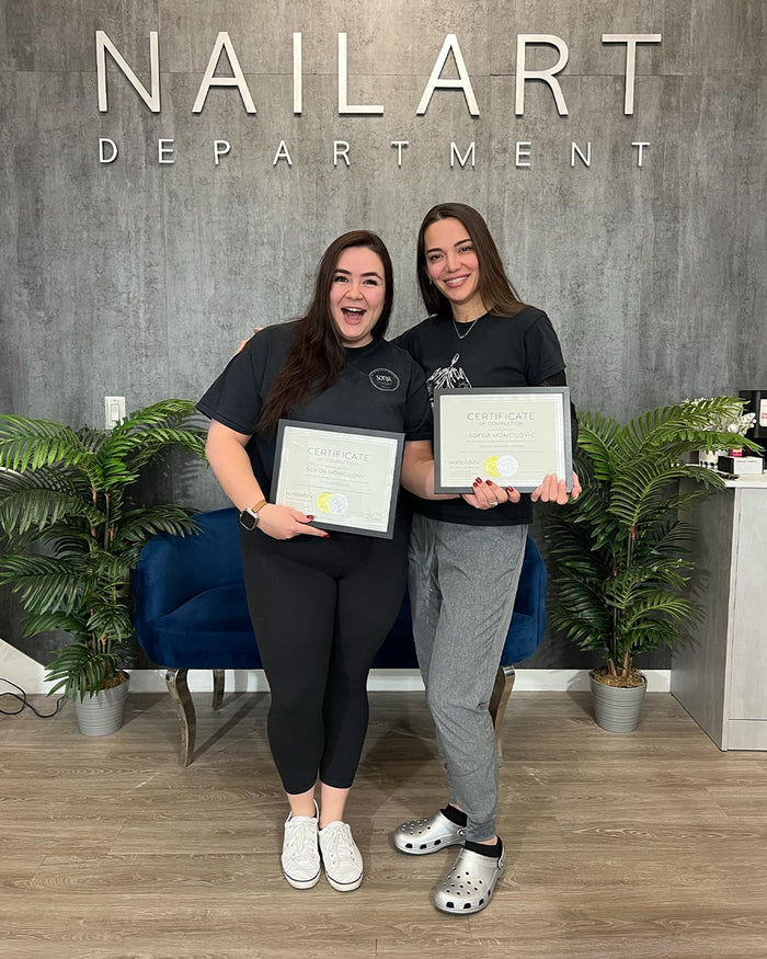 Nailspiracy Academy student with certificate
