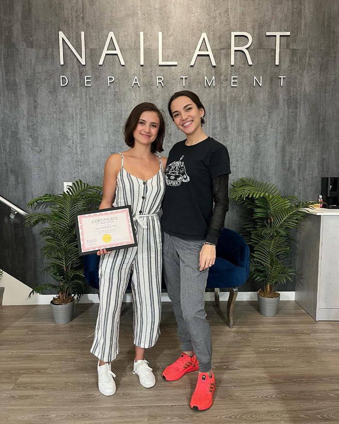Nailspiracy Academy student with certificate