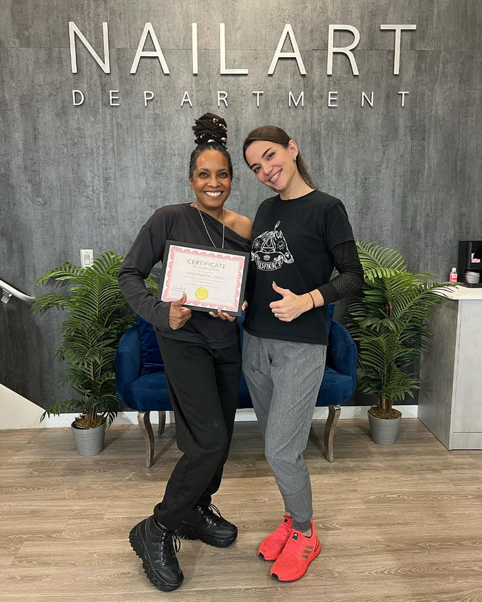 Nailspiracy Academy student with certificate