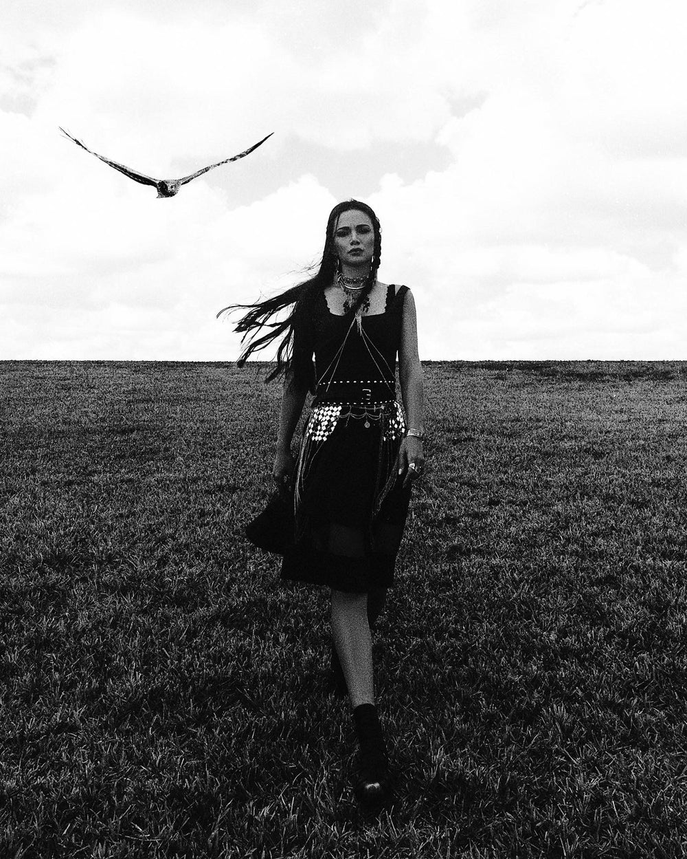 Creative fashion portrait of Siranush Ambartsumian outdoors in a dramatic black editorial look.