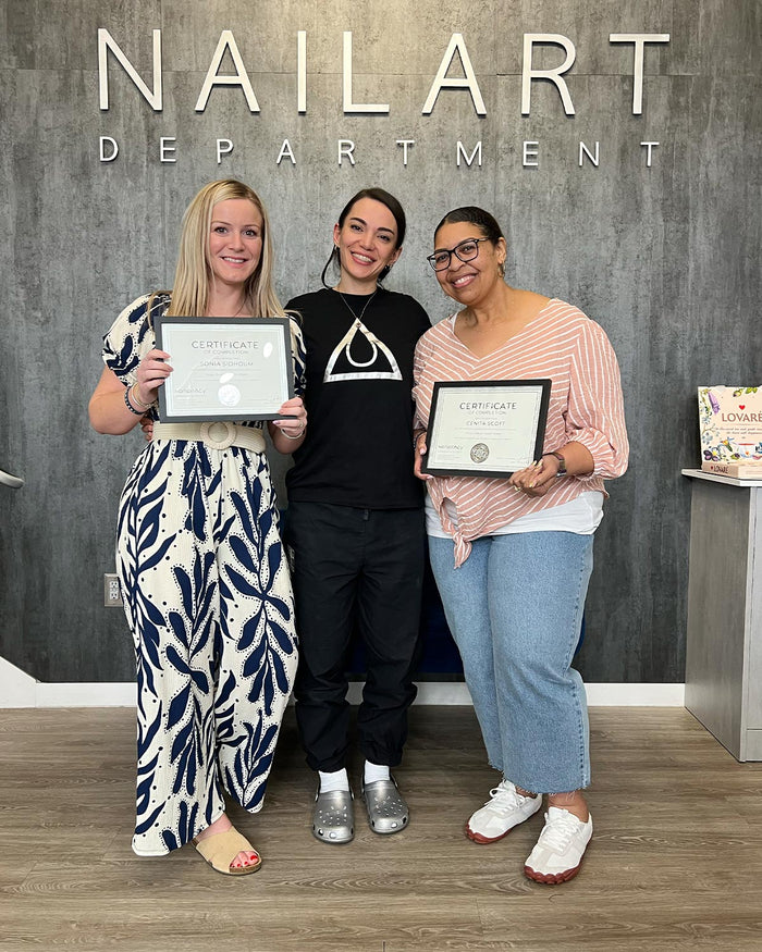 Nailspiracy Academy student with certificate