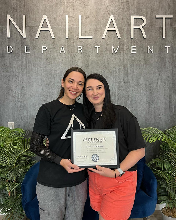 Nailspiracy Academy student with certificate